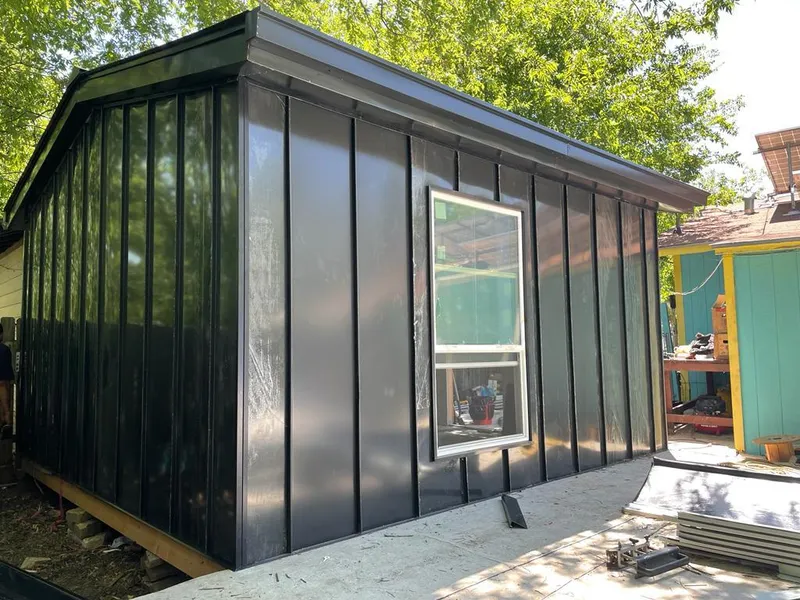 Black standing seam metal wall panels for Roof Inspection in The Colony