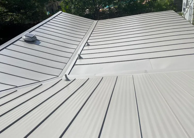 Solar attic fan installed on a metal roof for Roof Ventilation in The Colony