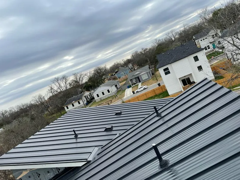 Standing seam metal roof panels with vents for Skylight Repair in The Colony
